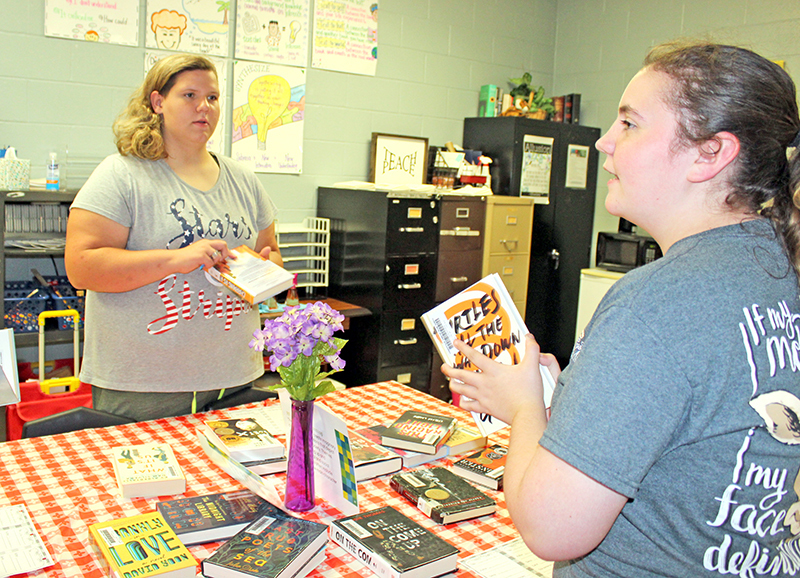 Mrs. Buerck and Mrs. Baskin lead a "book tasting" event at PHS