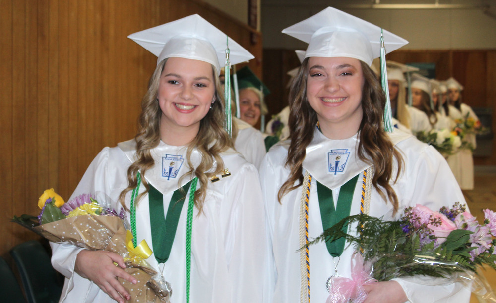 Seniors enter auditorium for commencement on May 21, 2021