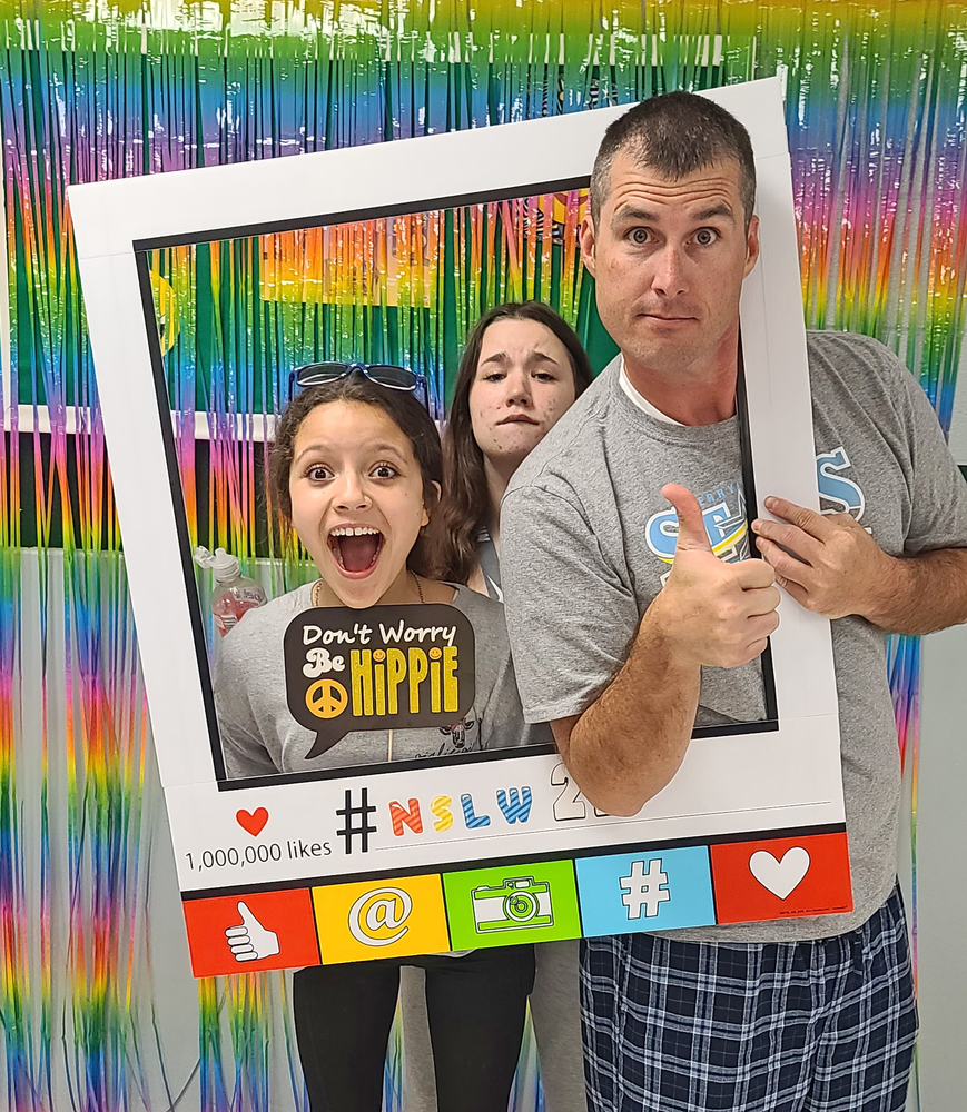 Students with Mr. Cowell in photo booth